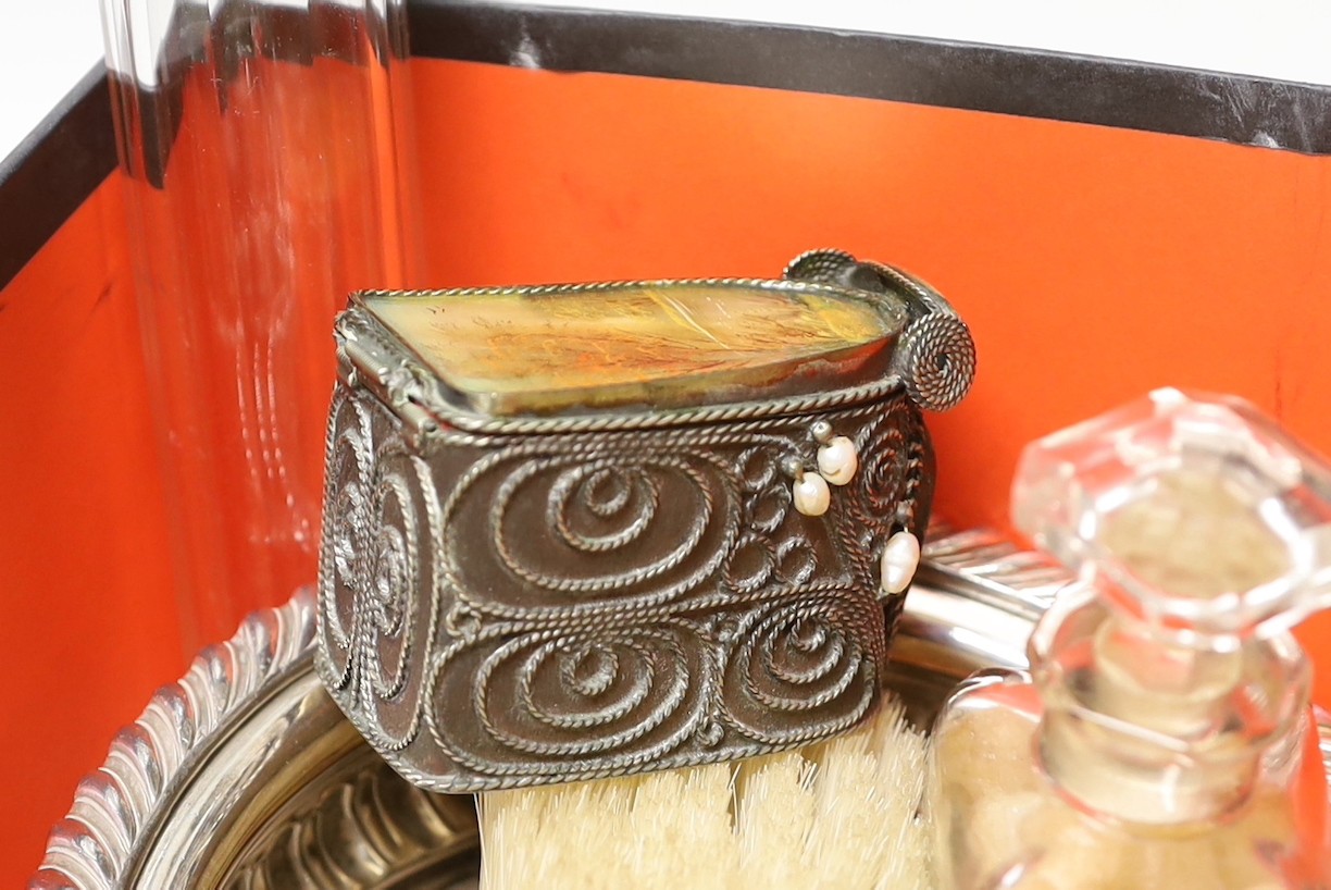 A collection of assorted silver mounted glass scent bottles and other items including a wine coaster etc.